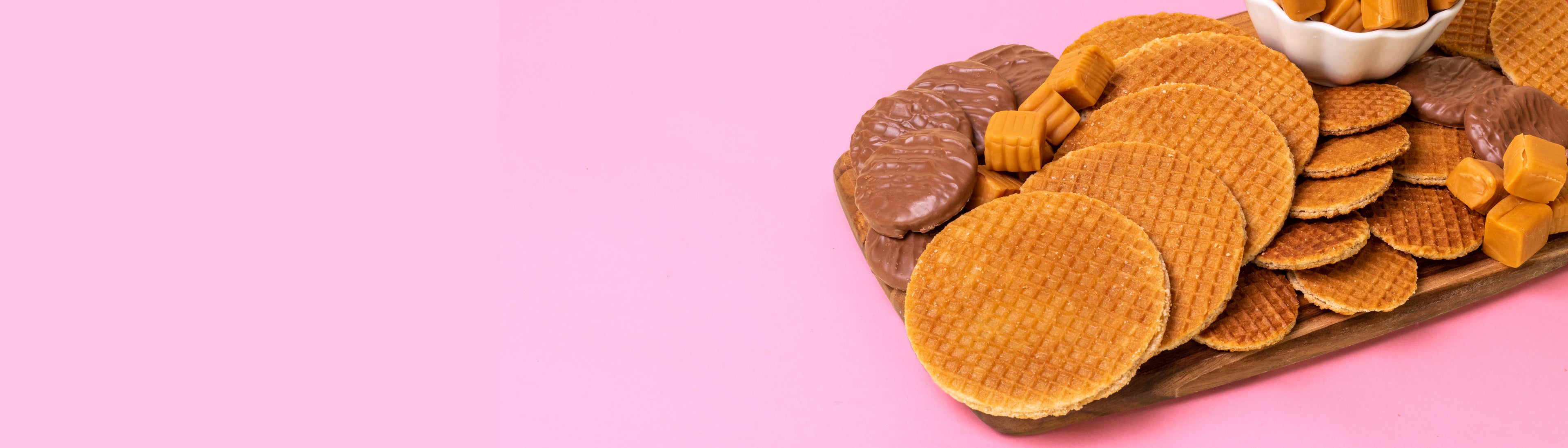 Charcuterie board filled with dutch caramel stroopwafels and chocolate stroopwafels.